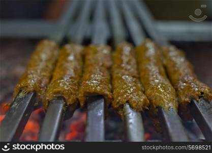 Close-up seekh kabab being barbecued