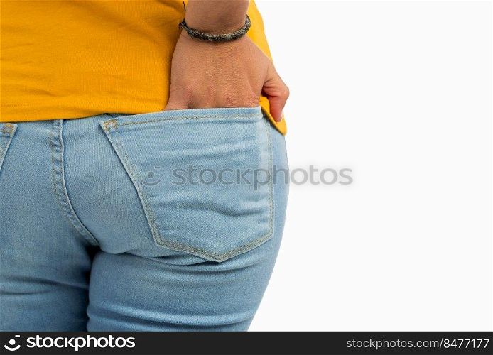 Close-up shoot of a young woman with hand on jeans pocket