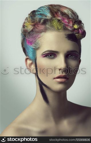 close-up shoot of beauty female with artistic make-up and hair-style, colorful painted hair and sensual eyes