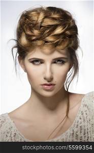 close-up shoot of pretty young girl with perfect skin, natural make-up and creative elegant hair-style