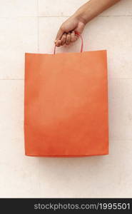 close up shopping bag holding by hand