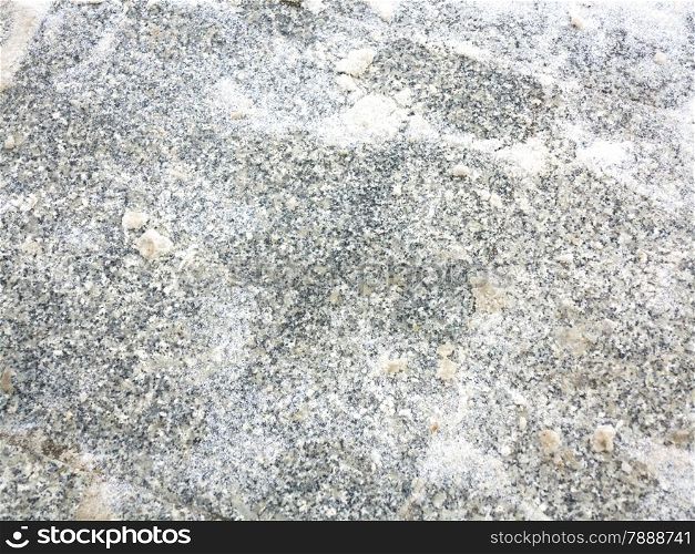 close up shot of a cobblestone alley, the paving stone and snow as background