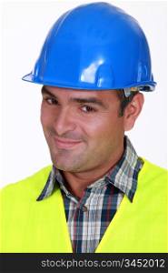 Close-up shot of a smiling tradesman