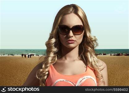 close-up shot of beautiful young woman with shiny long wavy hair, sexy singlet and sunglasses. Summertime concept