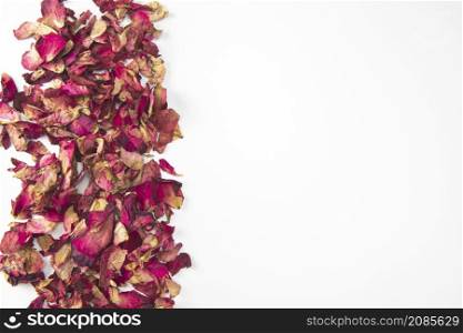 Close up shot of Dry rose petals background border,edge isolated on white background with copy space romantic wedding, Valentines Day design space for text. Close up shot of Dry rose petals background border,edge isolated on white background with copy space romantic wedding, Valentines Day design