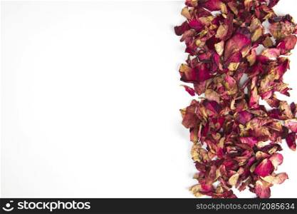 Close up shot of Dry rose petals background border,edge isolated on white background with copy space romantic wedding, Valentines Day design space for text. Close up shot of Dry rose petals background border,edge isolated on white background with copy space romantic wedding, Valentines Day design