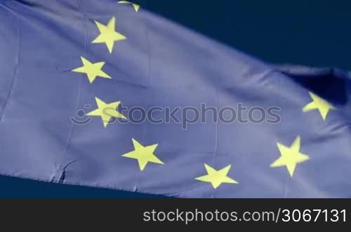 Close-up shot of European Union flag fluttering in the wind