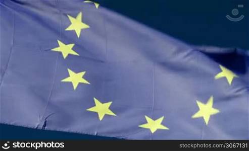 Close-up shot of European Union flag fluttering in the wind