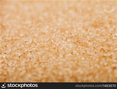 Close-Up shot of natural brown refined sugar cubes on white. Top view