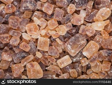 Close-Up shot of natural caramelized sugar cubes on white. Top view