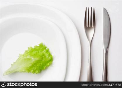 close-up shot of place setting with lettuce leaf