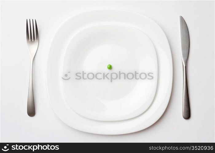 close-up shot of place setting with pea