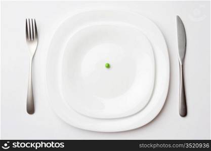 close-up shot of place setting with pea