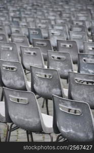 Close-up shot of several chairs in Saint Peter&acute;s Square in Vatican City, Italy.