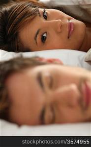 close-up shot of young couple in bed