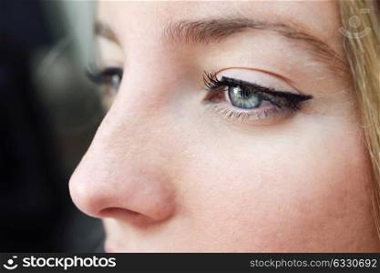 Close-up shot of young woman&rsquo;s eye. Woman with blue eyes.