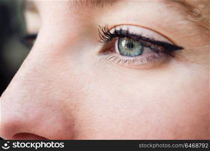 Close-up shot of young woman&rsquo;s eye. Woman with blue eyes.