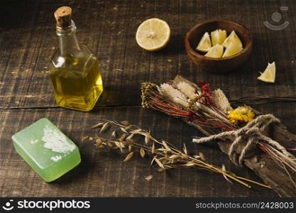 close up shot olive oil with lemon plants soap bar