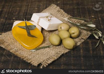 close up shot olives with soap bars sackcloth