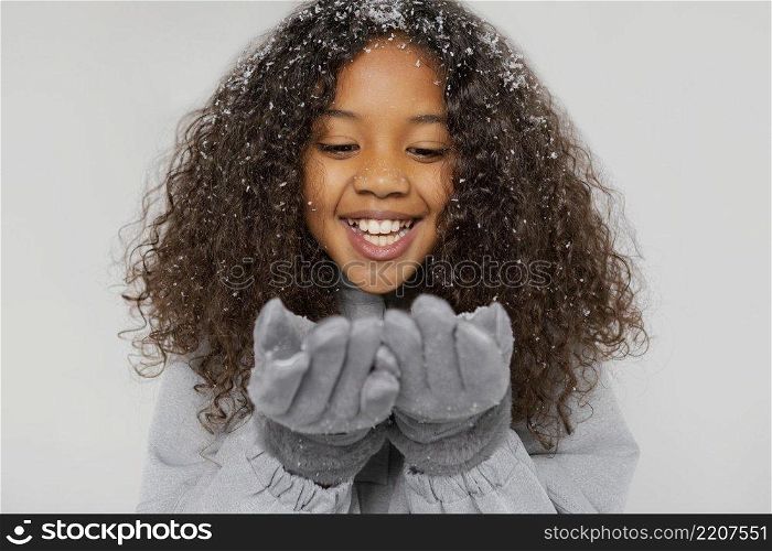 close up smiley girl wearing gloves