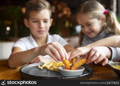 close up smiley kids eating fast food