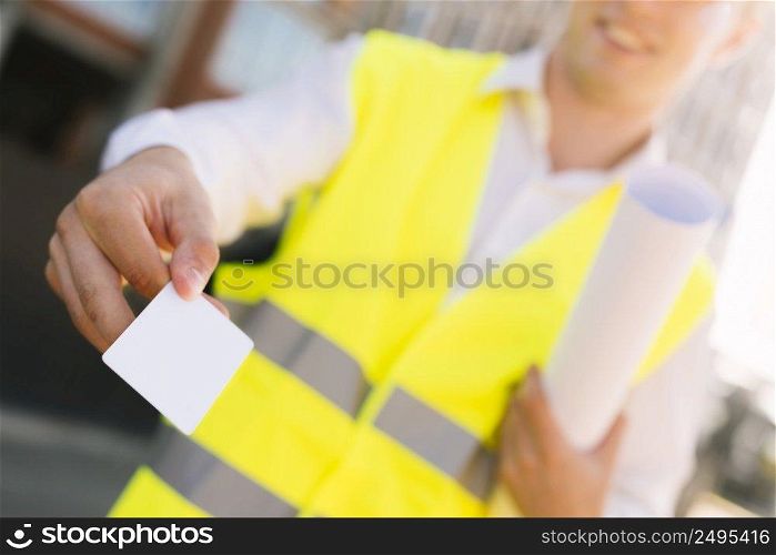 close up smiley man with business card