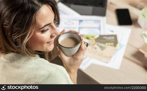 close up smiley woman holding coffee cup