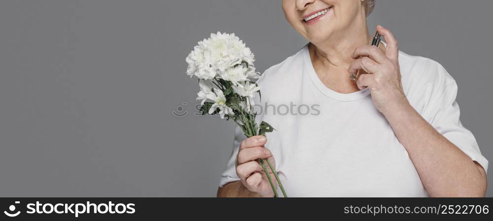 close up smiley woman holding perfume