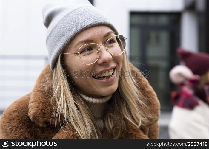close up smiley woman wearing hat