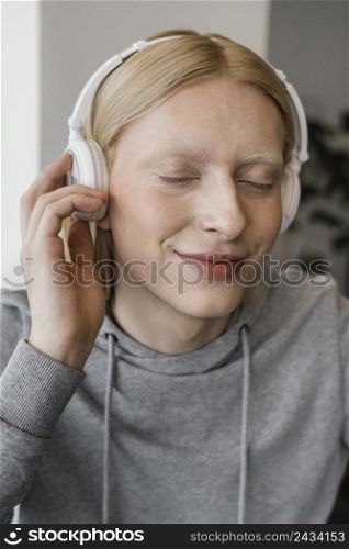 close up smiley woman with headphones