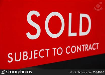 Close up Sold Subject to Contract Real Estate Agent Sign or Board