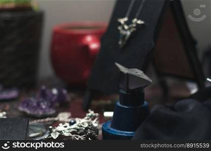 Close up stainless steel jewelry making workbench concept photo. DIY accessories. Side view photography with blurred background. High quality picture for wallpaper, travel blog, magazine, article. Close up stainless steel jewelry making workbench concept photo