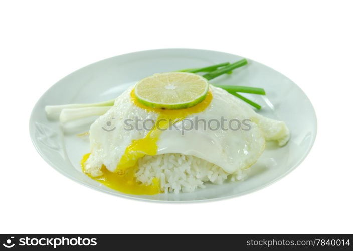 close up steamed rice and fried egg with fresh vegetable on white dish over white background