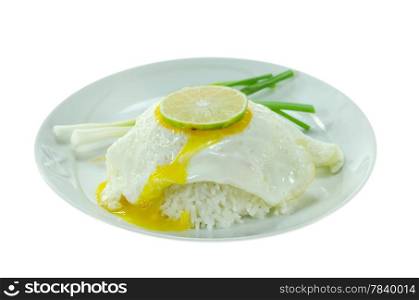 close up steamed rice and fried egg with fresh vegetable on white dish over white background
