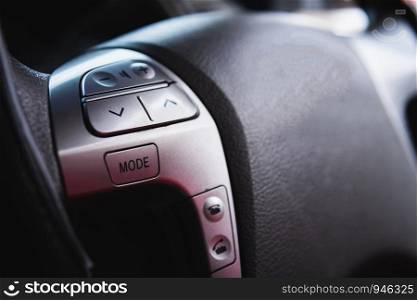 close up steering wheel with control buttons close-up. Car stereo system control