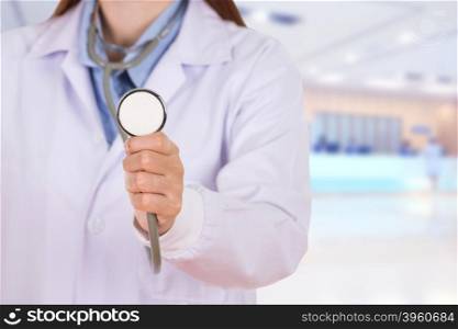 close up stethoscope with female doctor in hospital background