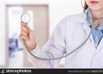close up stethoscope with female doctor in hospital background