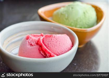close up strawberry ice cream and green tea ice cream in bowl
