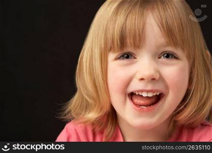 Close Up Studio Portrait Of Smiling Young Girl