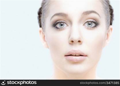 close-up studio portrait of young beautiful woman