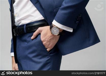 close-up studio shot stylish businessman wearing suit and watches. studio shot stylish businessman wearing suit and watches