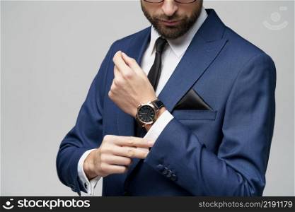 close-up studio shot stylish businessman wearing suit and watches. studio shot stylish businessman wearing suit and watches