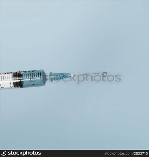 close up syringe with vaccine