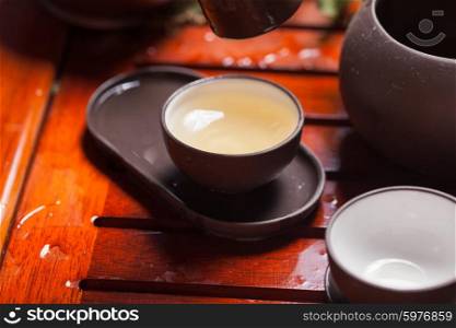Close-up table with earthenware for Chinese tea ceremony. Chinese tea ceremony