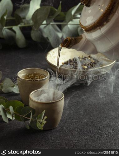 close up teacup pouring tea