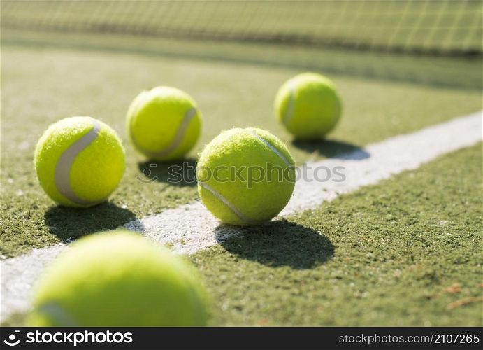 close up tennis balls ground