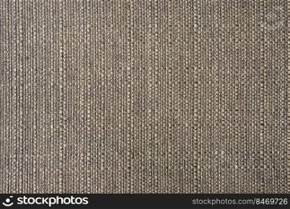 Close-up texture of natural gray coarse weave fabric or cloth. Fabric texture of natural cotton or linen textile material. Blue canvas background. Decorative fabric for upholstery, furniture, walls. Close up texture of gray coarse weave upholstery fabric. Decorative textile background