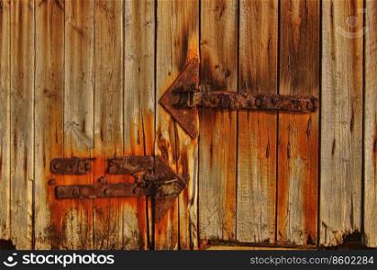 Close-up texture of the old gate with iron rusty details