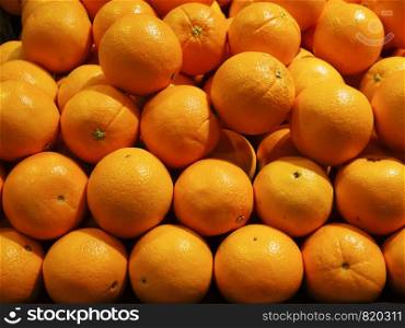 Close up the fresh orange fruit in the market.