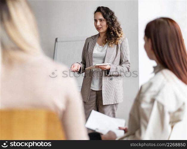 close up therapist discussing with people